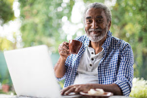 Senior man having coffee smiling