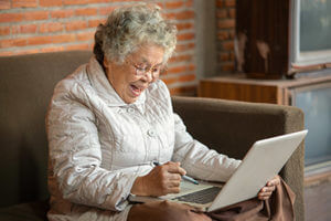 Senior woman using laptop