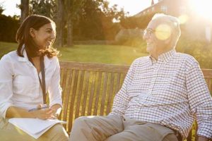 Man discussing senior living options with woman.