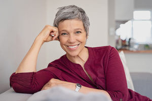 woman smiling in her personal care living program