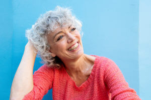 Woman smiling because of residential senior living options.