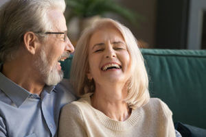 happy woman learning about senior living housekeeping services