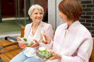 friends enjoying lunch through personal care living homes