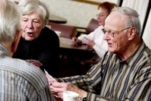 Seniors discuss senior living options at Discovery Village.