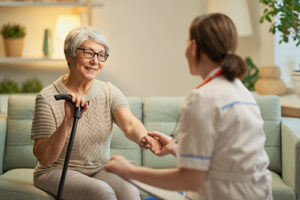 Woman is being helped at senior assisted living homes.