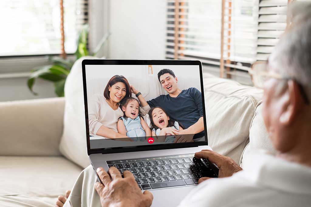 Friends online video conference by computer. Young people chat with each  other virtually in video call