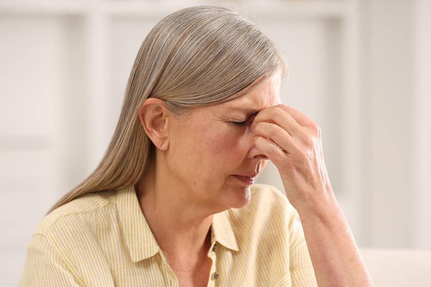 menopause woman suffering headache home